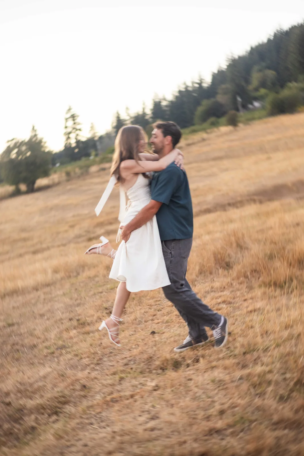 Couple spinning together in the field