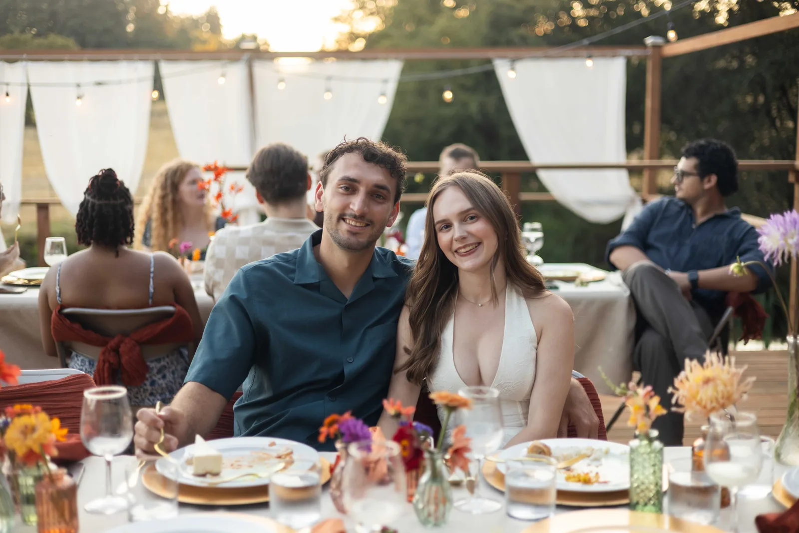 Guests smiling at a set reception table